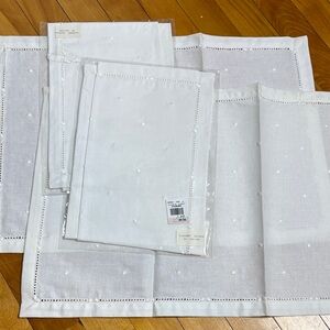 White, embroidered placemats